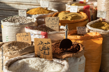 Spices, nuts and sweets shop on the market in Amman downtown, Jordan. Choice of Arabic spices on the Middle East bazaar, Jordan