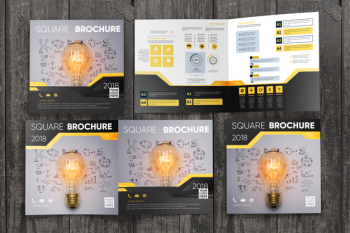 Square brochure mockup on wooden surface Free Psd