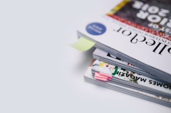 Stack of white magazines with copy space Stack of white magazines with copy space