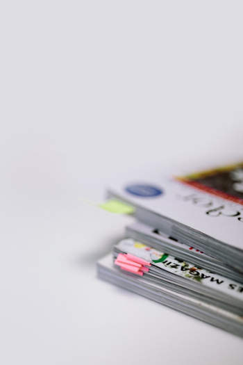 Stack of white magazines with copy space Stack of white magazines with copy space