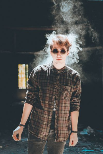 standing man with smoke near head standing man with smoke near head
