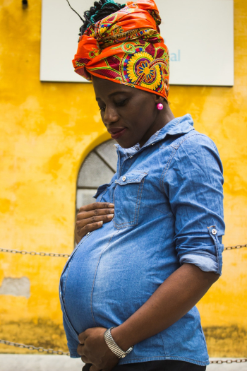 Standing Woman Holding Her Belly Standing Woman Holding Her Belly