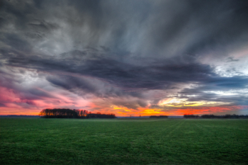 Storm Clouds over Field During Sunset Storm Clouds over Field During Sunset