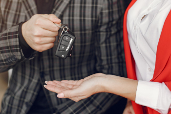 Stylish and elegant couple in a car salon Free Photo