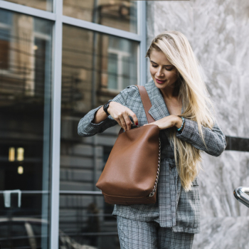 Stylish businesswoman in city environment Stylish businesswoman in city environment