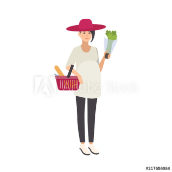 Stylish smiling pregnant woman wearing hat and carrying shopping basket with healthy food and wholesome products isolated on white background