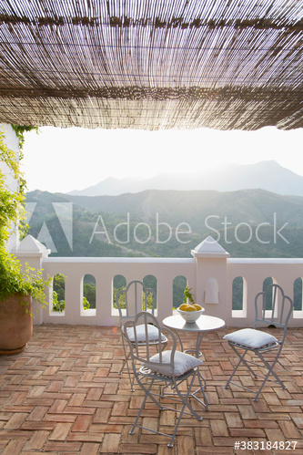 Sunny idyllic balcony overlooking mountain Sunny idyllic balcony overlooking mountain