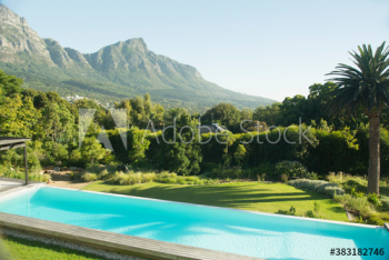 Sunny luxury lap pool with scenic mountain view Sunny luxury lap pool with scenic mountain view