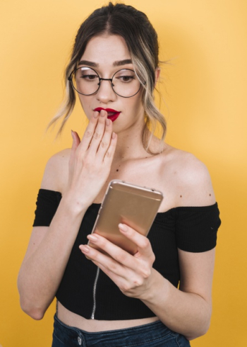 Surprised woman by black friday promotions Free Photo