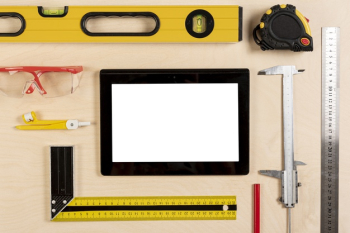 Tablet on architect desk with tools mock-up Free Photo