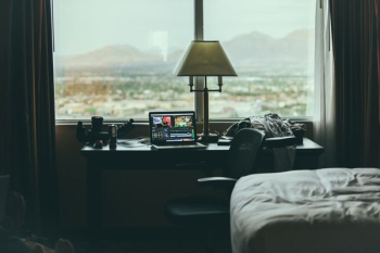 tabletop lamp beside laptop on desk beside window tabletop lamp beside laptop on desk beside window