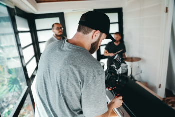 Taking Photo Of A Man Playing Instrument Taking Photo Of A Man Playing Instrument