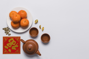 Tangerinea near teapot and cups Tangerinea near teapot and cups