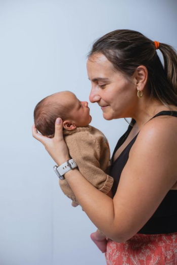 Tender Moment Between Mother and Newborn Baby Tender Moment Between Mother and Newborn Baby