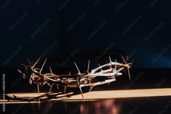 the crown of thorns of Jesus on  black background against  window light with copy space, can be used for Christian background, Easter concept