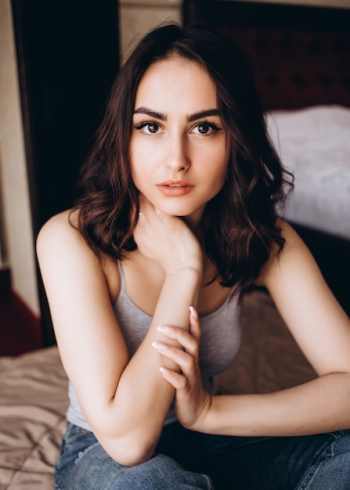 The stylish girl sits in the room The stylish girl sits in the room
