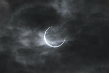 This is our star being eclipsed by our moon during an annular eclipse. I viewed this in Tokyo during the early hours of May 20th, 2012. I still remember the anticipation in everyone's faces due to the fact that the clouds would not open the sky to us but also because the light around us began to dim and we knew our window of opportunity to see the eclipse was fading. It was only in the last 10 or so minutes did the clouds thin out and leave a very translucent layer for the sun to be able to shine its light through for us to see a massive ring appear above us.