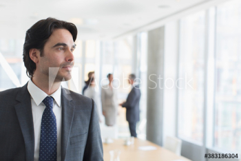 Thoughtful corporate businessman in office Thoughtful corporate businessman in office