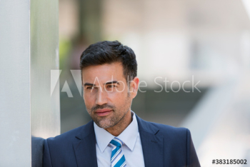 Thoughtful serious corporate businessman