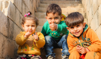 Three Children Sitting On Stairs Three Children Sitting On Stairs