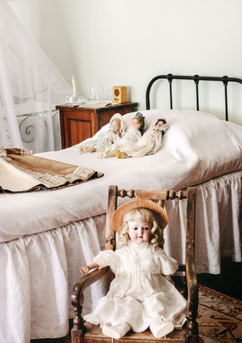 Three Dolls Lying on Bed Three Dolls Lying on Bed