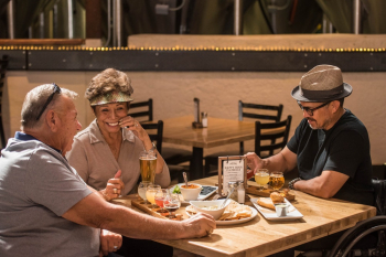 Three People Drinking Beer and Having Fun Three People Drinking Beer and Having Fun