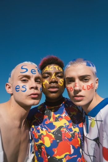 Three People With Face Paints Three People With Face Paints