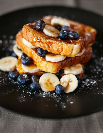 toast bread with blueberry on black plate toast bread with blueberry on black plate