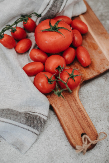 Tomatoes On Chopping Board Tomatoes On Chopping Board