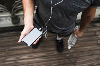 Top of man holding phone mock-up Free Photo