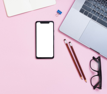 Top view desk concept with mock-up smartphone Free Photo