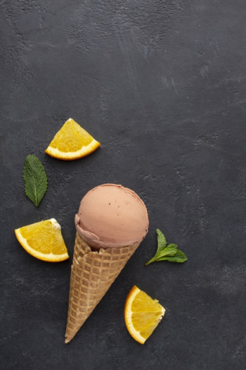 Top view ice cream on cone with orange Free Photo Top view ice cream on cone with orange Free Photo
