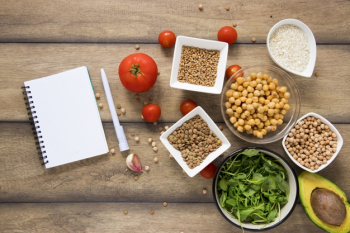 Top view notebook mock-up next to vegan goodies Free Photo