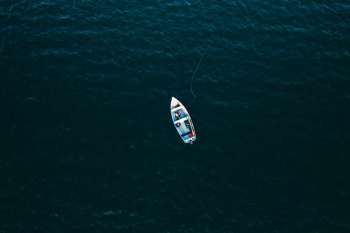 Top View Photo of Boat on Ocean