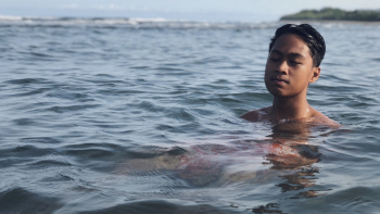Topless Boy Swimming On Sea Topless Boy Swimming On Sea