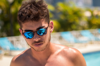 Topless Man Wearing Blue Lens Sunglasses Topless Man Wearing Blue Lens Sunglasses