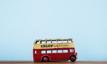 Toy Double Decker Bus On Blue Toy Double Decker Bus On Blue