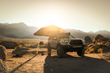 Toyota Pickup Truck Parked on Field during Sunset
