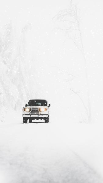Toyota SUV covered with snow Toyota SUV covered with snow
