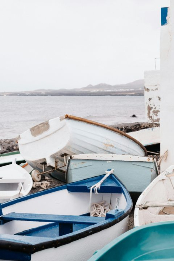 Tranquil Coastal Scene with Colorful Fishing Boats Tranquil Coastal Scene with Colorful Fishing Boats