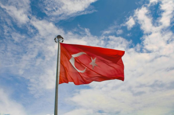 Turkish Flag Waving Against a Blue Sky Turkish Flag Waving Against a Blue Sky