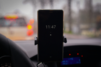 Turned-on Smartphone Displaying 11:47 Turned-on Smartphone Displaying 11:47