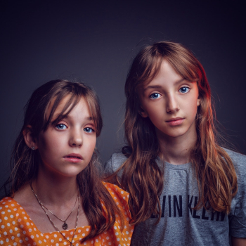 Twin Girls Standing Side By Side Twin Girls Standing Side By Side