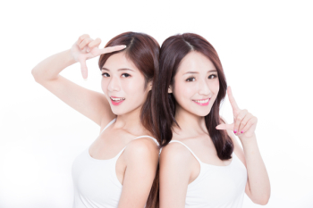 two beauty skincare woman make frame gesture on the white background