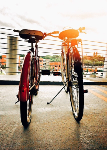 Two Bicycles Parked Upright Two Bicycles Parked Upright