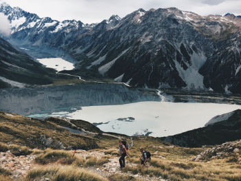 Two Hikers Climbing Up Mountain Two Hikers Climbing Up Mountain