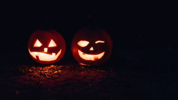 two lighted jack-o-lanterns during night time two lighted jack-o-lanterns during night time