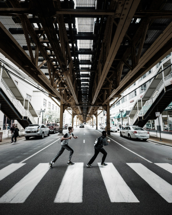 Two Men Crossing On Pedestrian Lane Two Men Crossing On Pedestrian Lane