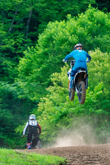 Two Men Riding Motocross Dirt Bikes Two Men Riding Motocross Dirt Bikes