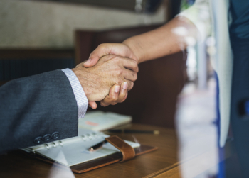 Two People Handshaking Two People Handshaking